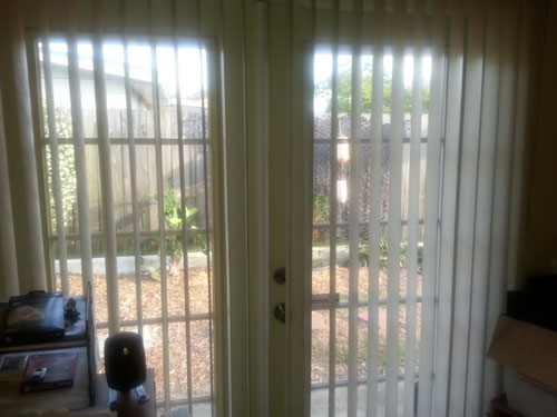 plantation window shutters - wood shutters painted white with adjustable slats