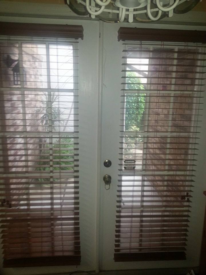 plantation window shutters - wood shutters painted white with adjustable slats